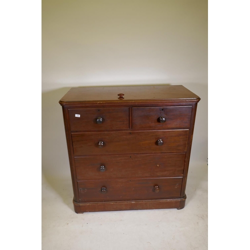 1200 - A Victorian mahogany chest of two over three drawers, with bun handles and lower cushion drawer, rai... 