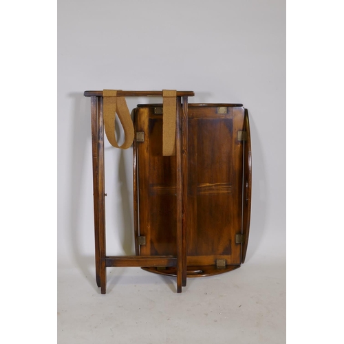 1201 - A stained pine butlers tray and stand, with brass hinged drop sides, 19