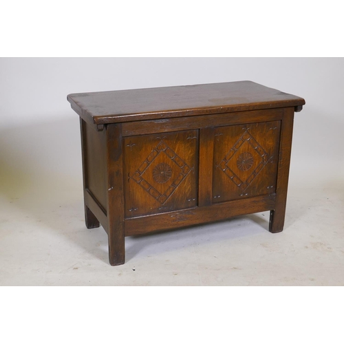 1202 - A 1930s carved oak coffer, 30