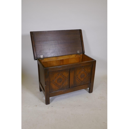 1202 - A 1930s carved oak coffer, 30