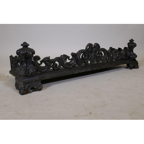 1205 - A Victorian cast iron fire surround with Rococo style decoration, 41