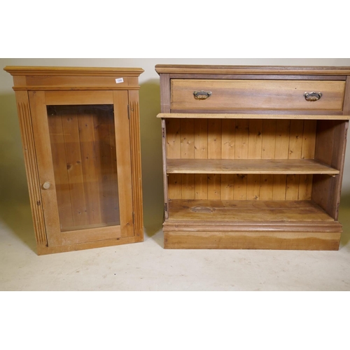 1209 - A pine cabinet with glazed door, 26