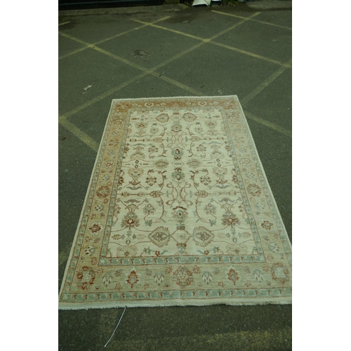 1216 - A cream ground Zeigler carpet, 65