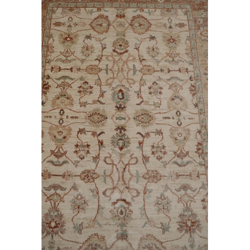 1216 - A cream ground Zeigler carpet, 65