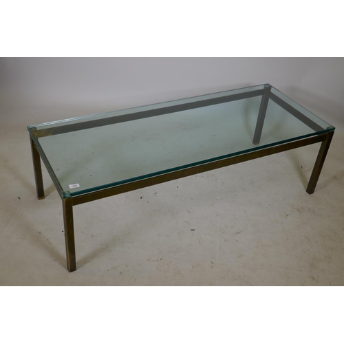 1226 - A bespoke solid brass coffee table with a plate glass top, 22