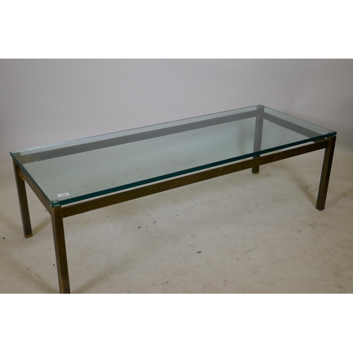 1226 - A bespoke solid brass coffee table with a plate glass top, 22