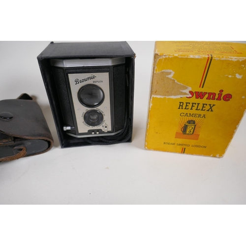 2 - A Kodak Brownie Reflex camera in original box, an Actus Ansco Vest pocket camera and a Kodak Junior ... 