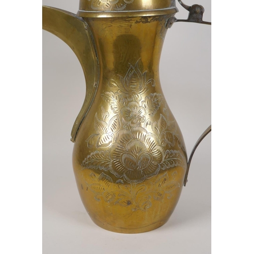 24 - A Turkish brass coffee pot with chased floral decoration, 23½