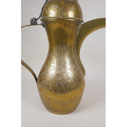 24 - A Turkish brass coffee pot with chased floral decoration, 23½