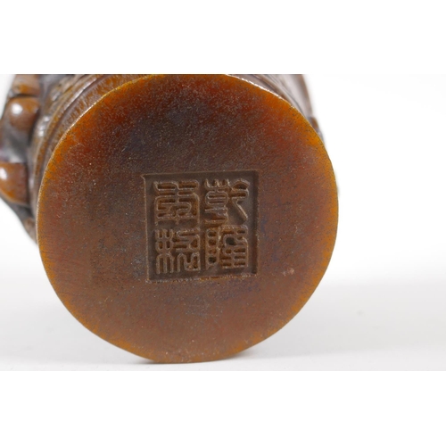 25 - A Chinese faux horn libation cup with raised kylin decoration, impressed mark to base, 4