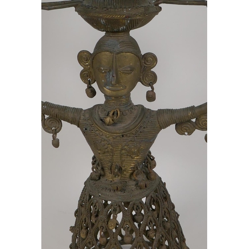 3 - An Indian bronze figural lamp base, cast as a female figure supporting a lamp holder, 16