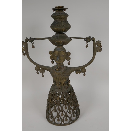 3 - An Indian bronze figural lamp base, cast as a female figure supporting a lamp holder, 16