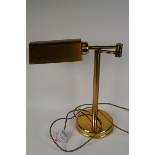 33 - An adjustable brass desk lamp on a tubular column, 17