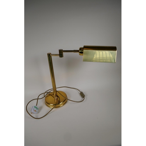 33 - An adjustable brass desk lamp on a tubular column, 17