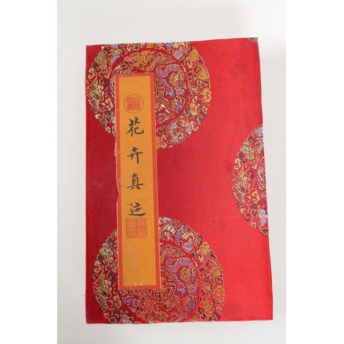 41 - A Chinese printed watercolour concertina book unfolding to make a single image of flowers, 7