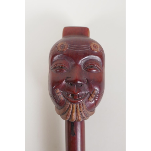 47 - A Japanese carved hardwood Noh mask incense holder, signed, 10½