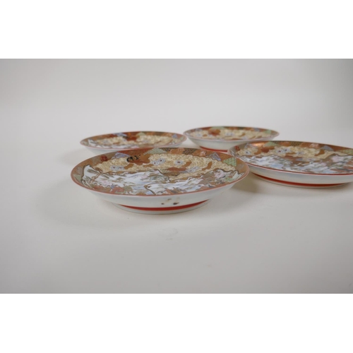 53 - A set of four Japanese Meiji period Kutani porcelain saucers in the Satsuma style depicting figures ... 