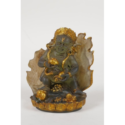 73 - A Sino Tibetan moulded smoked glass figure of a wrathful deity, with gilt highlights, 4