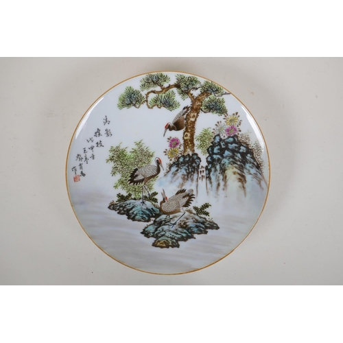 80 - A Chinese polychrome porcelain cabinet plate decorated with cranes on a river bank, character inscri... 