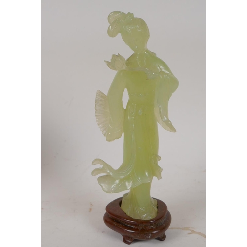 86 - A carved greenstone figure of a Chinese lady, on a hardwood base, 8