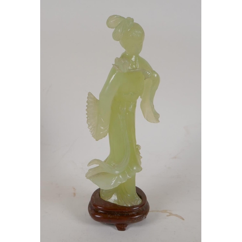 86 - A carved greenstone figure of a Chinese lady, on a hardwood base, 8