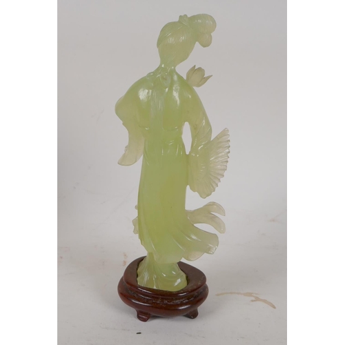 86 - A carved greenstone figure of a Chinese lady, on a hardwood base, 8