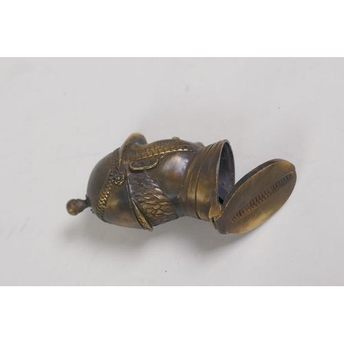 22 - A brass vesta case in the form of a policeman's head bust, 2½