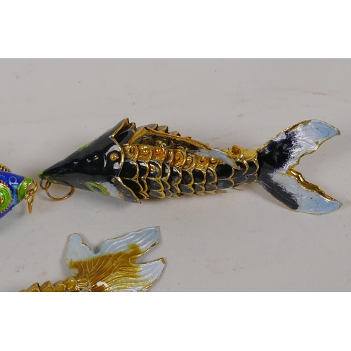 24 - Three small enamelled articulated models of exotic fish, largest 3½