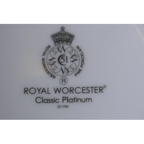 29 - A Royal Worcester 'Classic Platinum' dinner and tea service, eight 10½