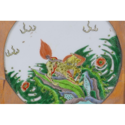 38 - A Chinese KangXi style famille vert porcelain plaque depicting a kylin, in a hardwood frame, 9&frac1... 