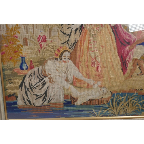 52 - A C19th needlework tapestry panel depicting Moses and the Pharoah's daughter at the river's edge, in... 