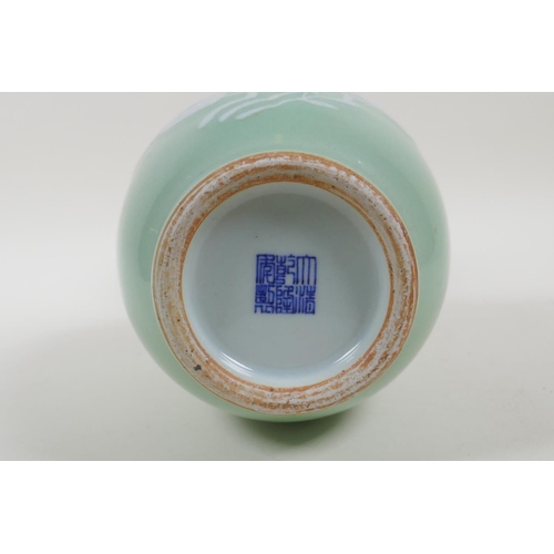 55 - A celadon glazed porcelain vase with raised peach and bat decoration, Chinese Qianlong seal mark to ... 