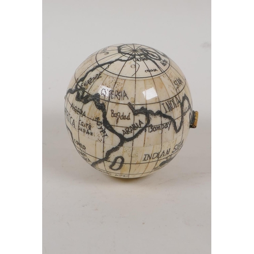 56 - A bone globe, opening to reveal a compass, 3