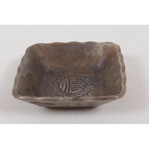 6 - A Chinese square section white metal dish cast with dragons and symbols, 4 character mark to base, 3... 