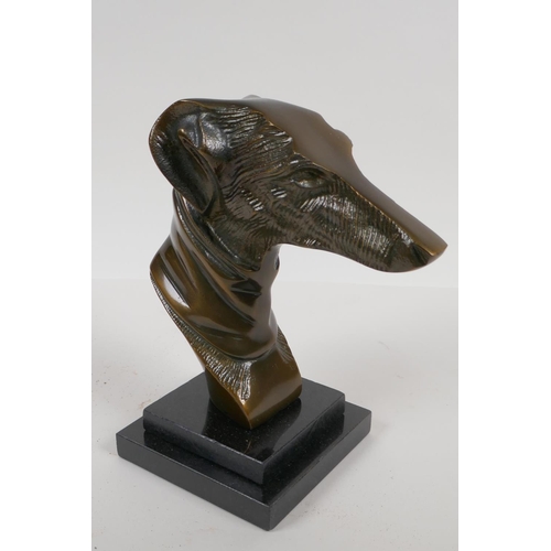 7 - A bronze bust head of a greyhound on a stepped marble base, 9