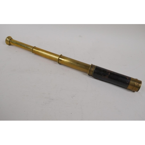 9 - An antique brass three draw pocket telescope, 14