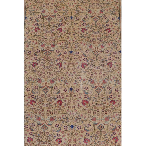 1174 - An antique Anatolian Kayseri cream ground wool rug with multi-colour all over floral design, AF wear... 