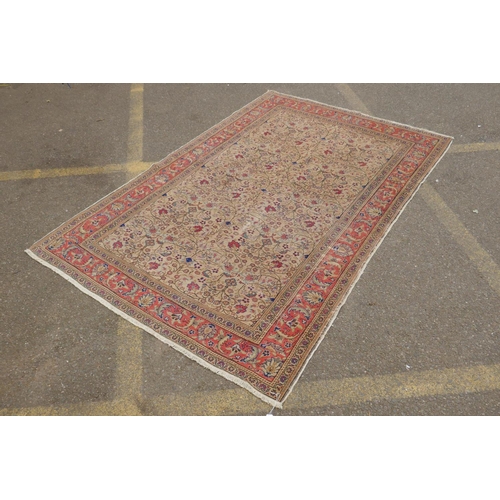 1174 - An antique Anatolian Kayseri cream ground wool rug with multi-colour all over floral design, AF wear... 