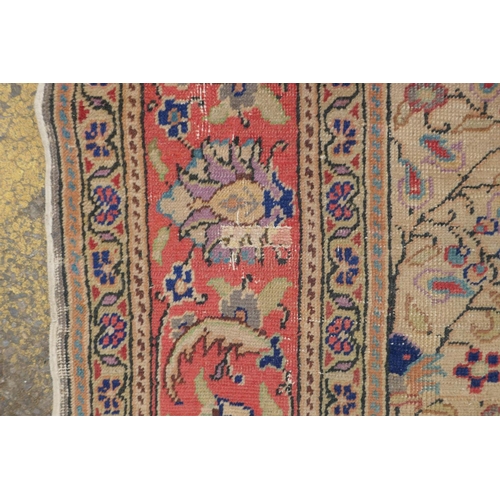 1174 - An antique Anatolian Kayseri cream ground wool rug with multi-colour all over floral design, AF wear... 