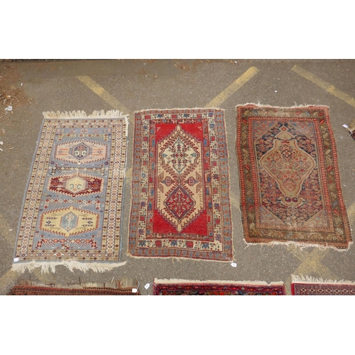 1182 - A Persian blue ground wool rug with geometric medallions and stylised birds design, a red ground Her... 