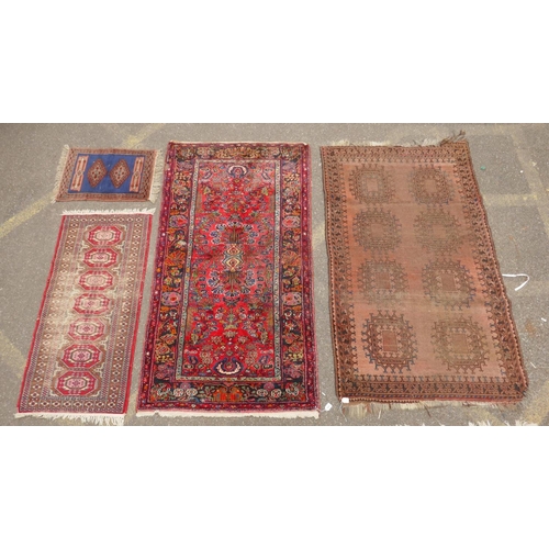 1175 - A Turkish rust ground wool rug with a medallion design, a worn red ground Bokhara runner, a deep pil... 