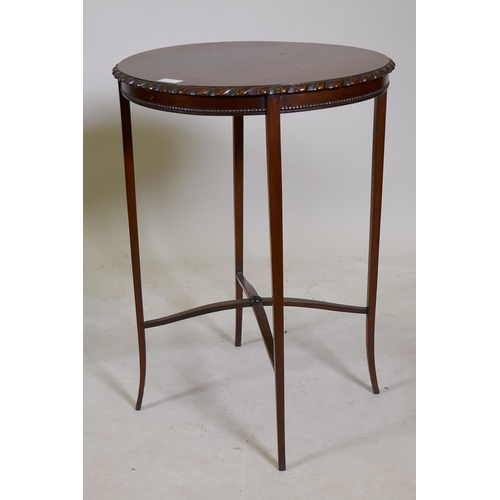 1184 - A Victorian mahogany fold over card table on cabriole legs with shaped stretcher, 28