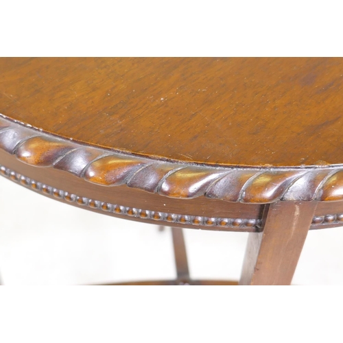 1184 - A Victorian mahogany fold over card table on cabriole legs with shaped stretcher, 28