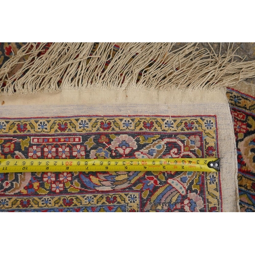 1191 - A Persian multi colour Heriz design silk rug, wear, 38½