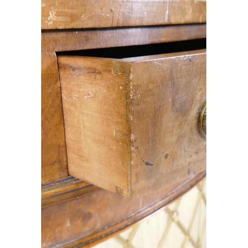 1168 - An early C20th yew wood corner cabinet with a shaped gallery and fringe, raised on swept feet, the d... 