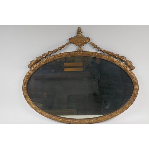 1173 - A gilt framed Adam style oval wall mirror, 23½