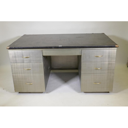 1181 - A mid C20th brushed steel industrial style kneehole desk with rubberised top, fitted with five drawe... 