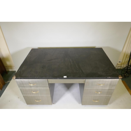 1181 - A mid C20th brushed steel industrial style kneehole desk with rubberised top, fitted with five drawe... 