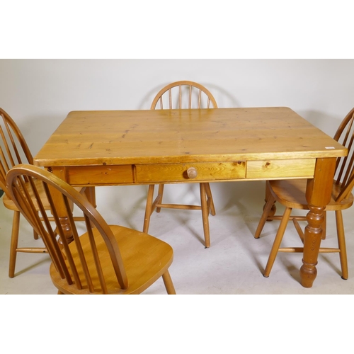 1199 - A pine kitchen table with single drawer and four hoop back beechwood chairs, 34