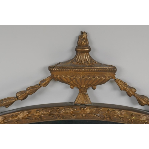 1173 - A gilt framed Adam style oval wall mirror, 23½